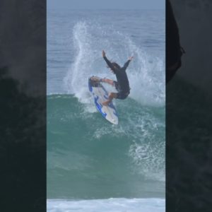 SURFER DOES BLOWTAIL SNAPS (SLO-MO)